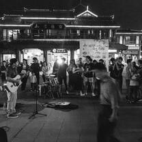 Playing music on the street in Chongqing, China.