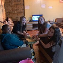 Plucking Corn Helping Mama Sara at the volunteer house to pluck corn with our hands!