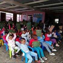 Once a week, volunteers visit young children at the local crèche to give a lesson on basic English words based on the theme of the week. 