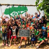 Excited Primary School Kids with Volunteers
