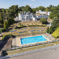 Camp location with British manor and pool