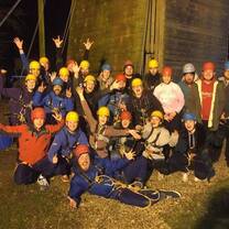 Camp staff group photo at wall climbing team building event