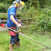 Staff member maintaining camp grounds
