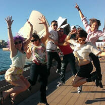 group jumping for joy at the famous Sydney Opera House