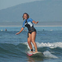 girl Catching waves