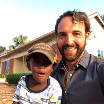 Intern having a great moment with his little host brother