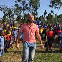 Intern having a fun moment with the school children