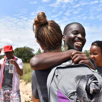 Volunteers greet each other at fieldbase