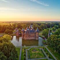 Aerial view of castle at sunset.