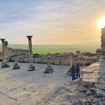 Enjoying Roman ruins in Morocoo at sunset