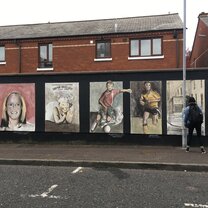 Murals on one of the peace walls in Belfast Murals on one of the peace walls in Belfast