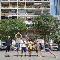 students posing outside building