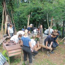 Caring the traditional cooking station to the new indigenous house