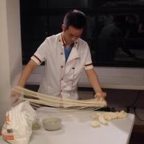 Chef preparing Chinese Noodles, China, 2012.