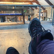 view of my feet while sitting on one of the sofas on the second floor of the barn where we do art