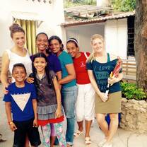 Volunteers work alongside teachers to support children's education. 