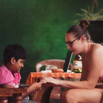 Volunteer playing with a young Indian girl