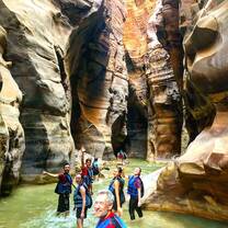 Students explore a river in the base of a canyon 