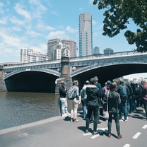 group next to water in a city