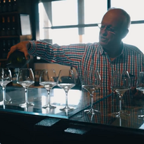 man pouring wine