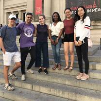 Students pose for a photo on a warm day in New York.
