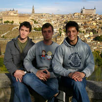 Students pose in front of the city