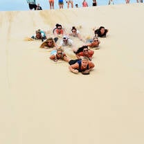 Sandboarding-in-Port-Stephen-Amazing-8-Day-Oz-Gap-Year-Experience-Grabatour-Travel