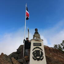 dominican flag next to statue