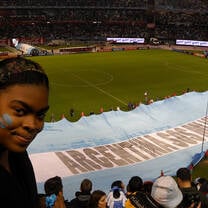 A student at an Argentina futbol game