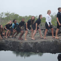 Students reenacting Darwin's terry of evolution