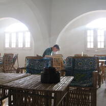 Student studies in a traditional room in Anafora, Egypt