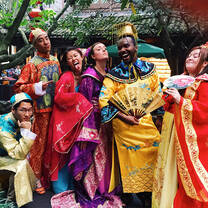 Students dress in traditional Chinese outfits for a fun photo