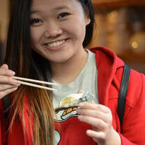 A student eating sushi
