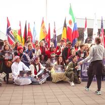 people in international costumes and flags 