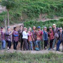 Group of elephant project workers about to begin a new task to improve the lives of the elephants