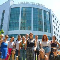 Posing on front of one of TaF.tc campuses