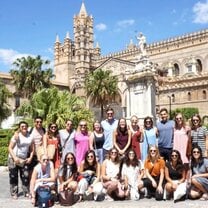 group of students in Italy in front of building 