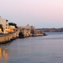 Study Abroad Programs at SCIE CENTER Syracuse ocean and city landscape with sunset