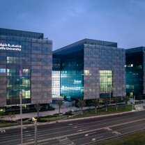Khalifa University Main campus a dusk, structures surrounded by landscaped green in the heart of Abu dhabi Khalifa University Main campus a dusk, structures surrounded by landscaped green in the heart of Abu dhabi