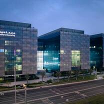 Khalifa University Main campus a dusk, structures surrounded by landscaped green in the heart of Abu dhabi