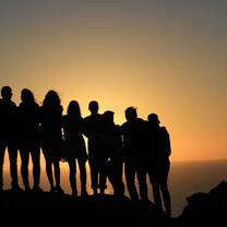 Watching the sunset with close friends over Santorini Greece