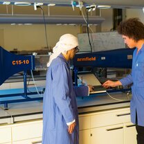 An arab and an international student work in the manufacturing and development facility An arab and an international student work in the manufacturing and development facility
