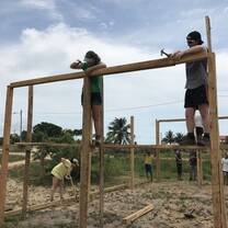 Two people working on a construction site.