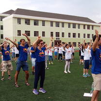 Photo of Volunteers and Children Dancing 