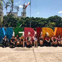 Volunteer team in front of the MERIDA sign. 