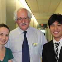 Law interns taking a photo with their supervisor