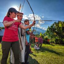Professor Julie Madewell from Indiana University shoots and bow and arrow