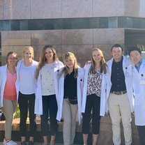 My 8 fellows and I in our lab coats outside the hospital.