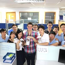 Bussiness interns from internship in china program taking photos with co-workers in the office