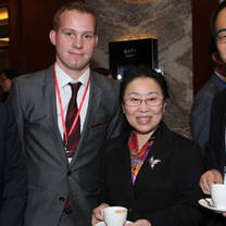 Law intern having a tea party with co-workers & clients